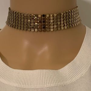Gold choker has chain closure to adjust size